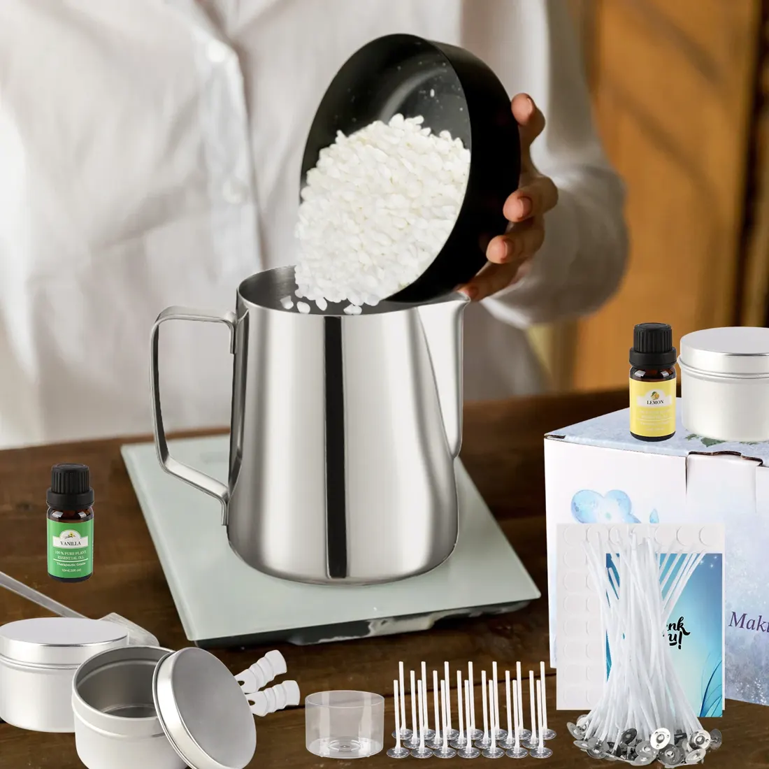 Soy wax flakes being poured into the stainless melting pitcher